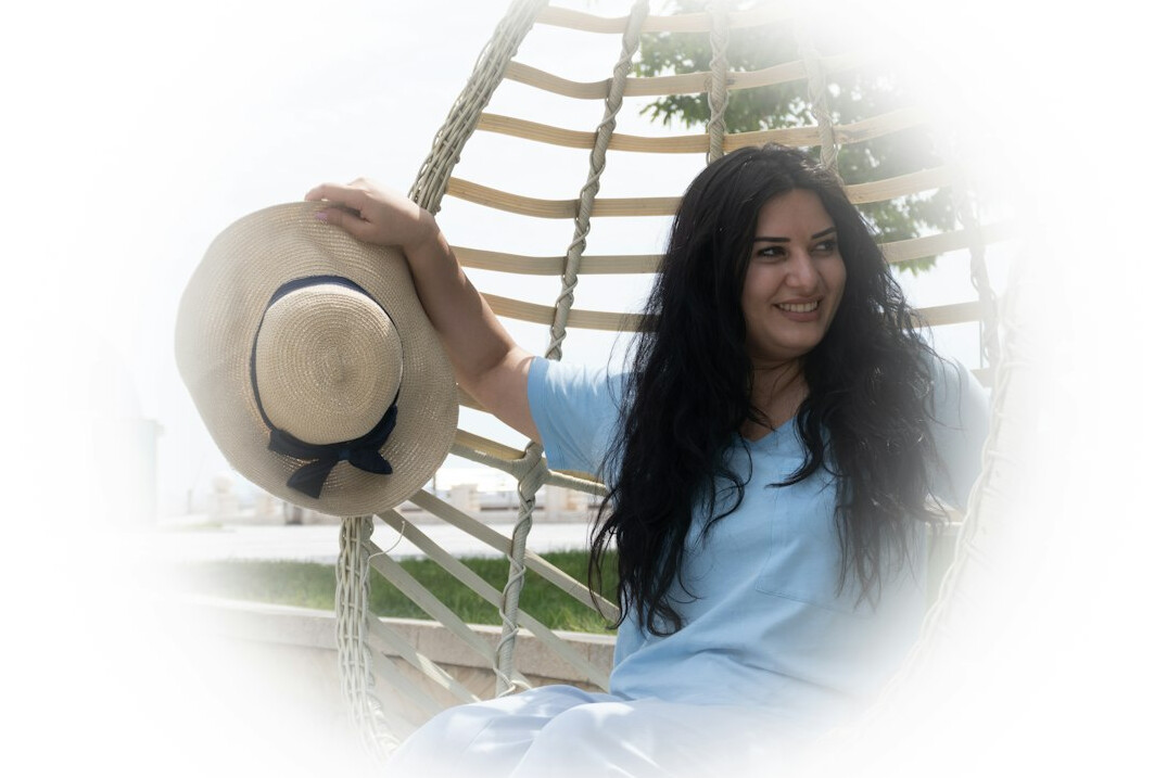 Young British Indian woman with long dark hair smiling